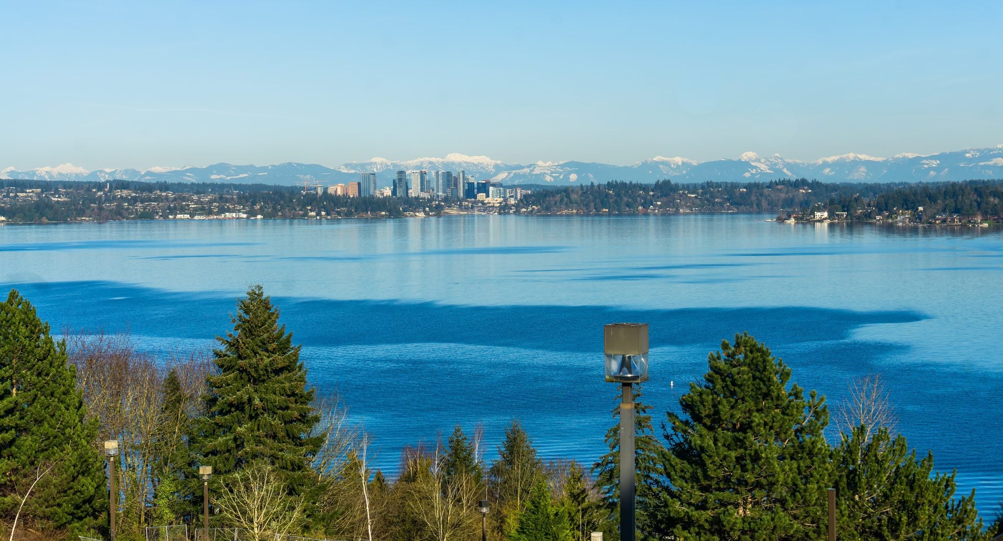 Seattle skyline with Lake Washington and snow-capped mountains